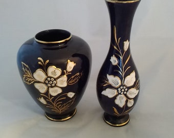 Set of black ceramic vases with heavy white enamel and gold flowers.  Vase 202