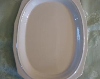 A Pfaltzgraff 14 inch by 10.5 inch platter in the Heritage all white pattern with 12 sided rim.  DWS 320