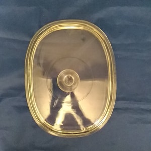 A large clear rectangular glass Pyrex replacement lid..  It will fit an 11"" by 8.5" Pyrex or Corningware dish. CD 12