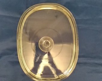 A large clear rectangular glass Pyrex replacement lid..  It will fit an 11"" by 8.5" Pyrex or Corningware dish. CD 12