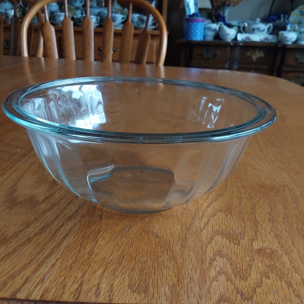 A Pyrex clear ribbed glass mixing bowl, #323 that holds 1.5 liter.  It is not to be used under the broiler or on the stovetop.  Bowl 1348