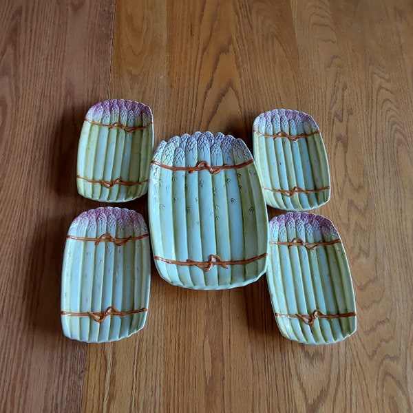 Marked-Made In Italy, 5 piece set of a majolica tied asparagus spears platter no. 4965 and 4 individual serving plates no. 4964.  Plates 896