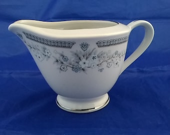 A fine China creamer in the Robin design, a blue floral with platinum trim.  DWS 54