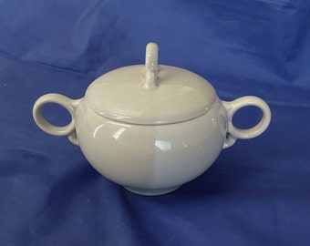 A Ballerina pottery lidded sugar bowl with loop handles, made by Universal.  It is circa 1950s, made in the USA.  Dish 1585