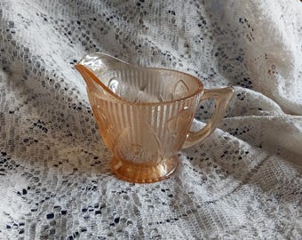 Jeanette Glass footed creamer is the Iris and Herringbone pattern in a orange iridescent glass.  Dish 2176