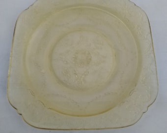 By Federal Glass, in the Madrid pattern, is a yellow depression glass 6" bread and butter plate.  Dish 868