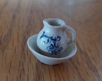 Marked Graber '81 dollhouse miniature 2 pc stoneware wash basin and pitcher by artisan Jane Graber with a blue floral design.  Mini 86