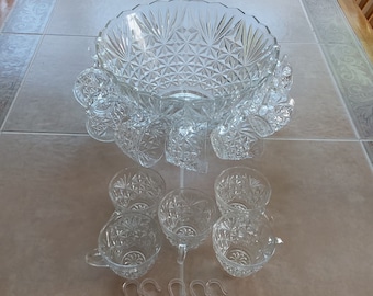 By Anchor Hocking in the Arlington pattern, a complete 26 pc. punch bowl set of the large glass punch bowl, ladle 12 cups & 12 hooks.  PB 43