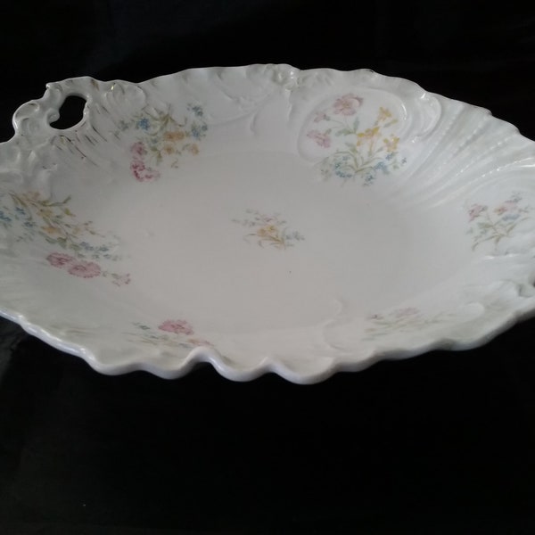 An antique Carl Tielsch Altwasser marked  porcelain hand painted shallow bowl with reticulated handles from the early 1900s.  Bowl 1014