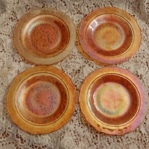 Federal Glass iridescent orange set of 4-6" wide bread and butter plate in the Normandie Pattern with a delicately scalloped rim.  DWS 15