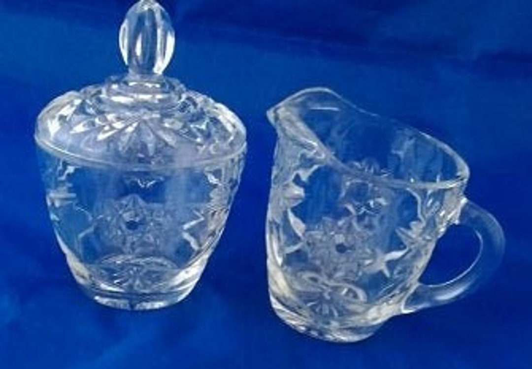 A Matching Clear Glass Sugar Bowl With Lid and Creamer in Star of David
