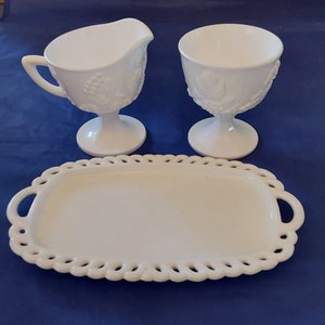 Colony white milk glass creamer and sugar in Harvest Grape with matching underplate with open lace rim by Indiana Glass.  MG 383