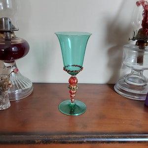 Stunning Venetian hand made Murano Glass wine goblet that is a green bowl and base goblet with a red and flecked gold bubble stem . Bar 1062