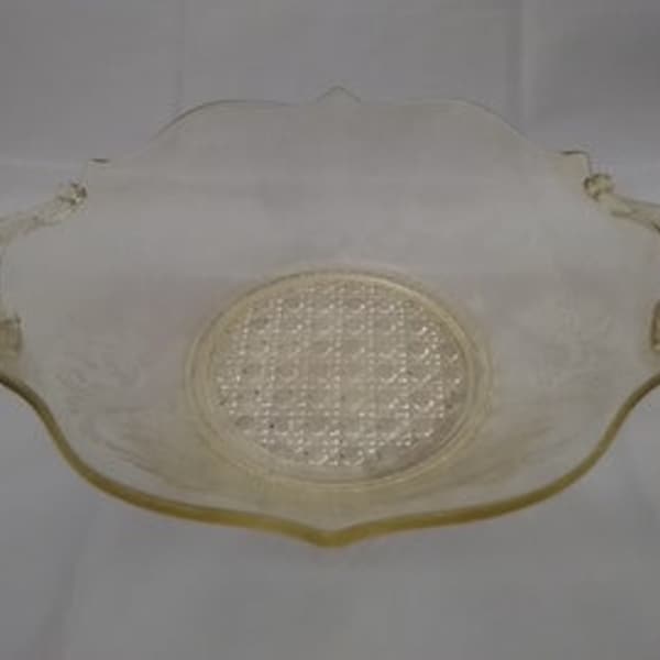 A yellow topaz depression glass 9.25" wide Lancaster Landrum etched serving bowl with scroll handles.  Bowl 263