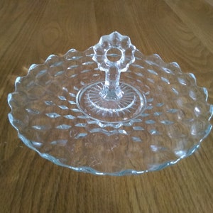 A Fostoria Glass 12 in wide tray with center handle in the American Clear Cubist design.  Plate 714
