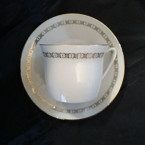 A royal Epaig matching porcelain 6 oz cup and saucer with gold filigree trim, that were made in Czechoslovakia.  CS 269