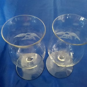 A set of 2 matching short stemmed 8 oz brandy or cognac snifters with etched eagles.  Bar 812