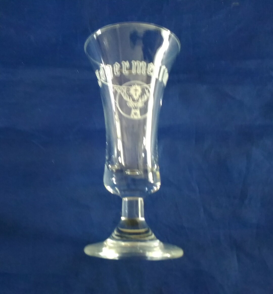A Short Stemmed Glass Jagermeister Shot Glass With Their White Stag