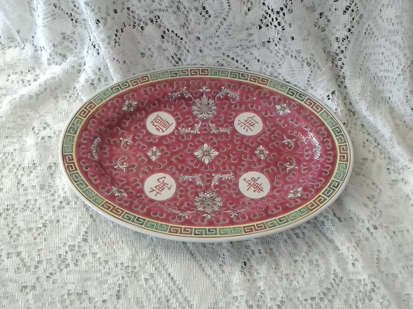 An Oval 12 Inch Mun Shou Porcelain Platter in the Famille Rose