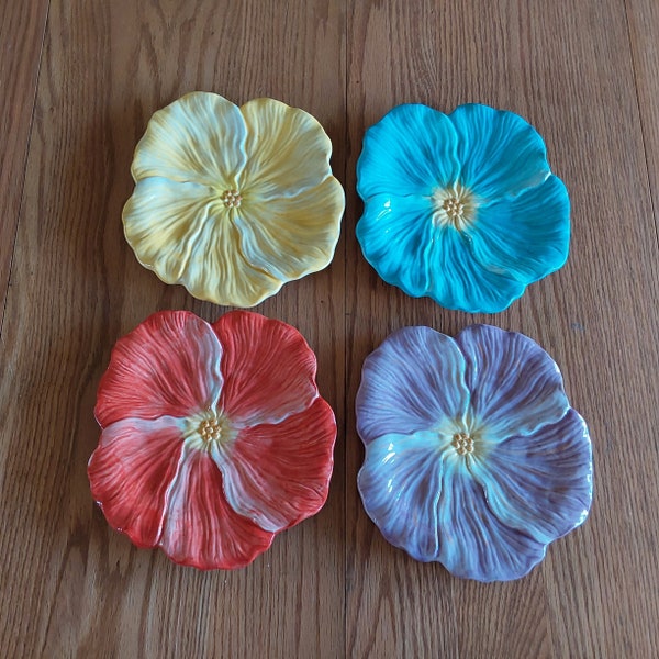 By Portfolio...OtO, is a set of 4 different colored Hibiscus flower 8 inch wide plates ìn purple, red, yellow, and blue.  Plates 895