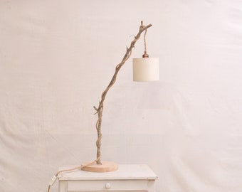 Unique natural wood lamp with a hanging bulb and braided jute flex