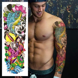 May include: A colorful temporary tattoo design featuring a fish, a snake, a rabbit, and flowers. The tattoo is designed to be applied to the arm.