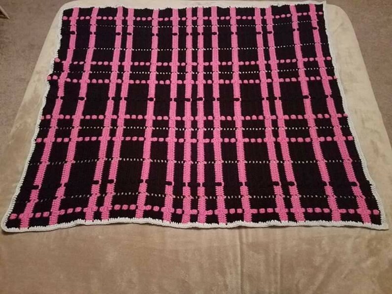 Black and pink plaid crochet afghan