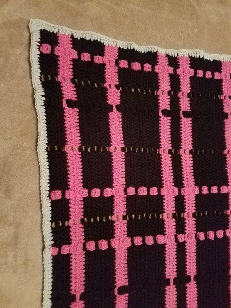 Black and pink plaid crochet afghan
