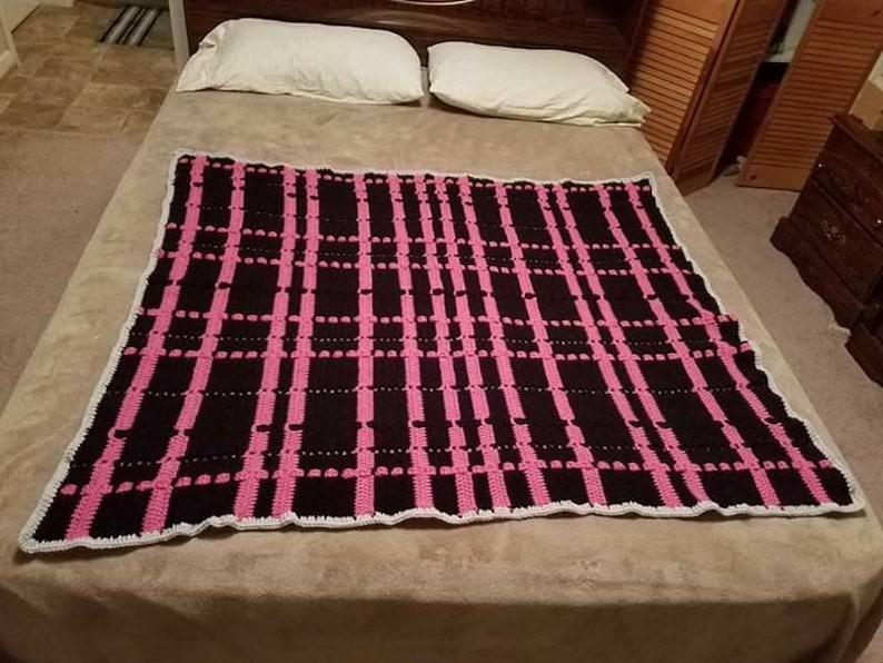 Black and pink plaid crochet afghan