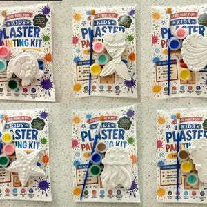 May include: Six kids plaster painting kits in individual plastic packaging. Each kit contains a white plaster figure, a blue paintbrush, and three small paint pots. The packaging features the text Kids Plaster Painting Kit and colorful paint splatters.
