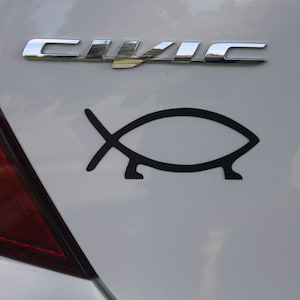 May include: A set of three ceramic mugs with a speckled, matte finish. The mugs are in shades of gray, white, and black. Each mug has a simple, modern design, perfect for coffee or tea.