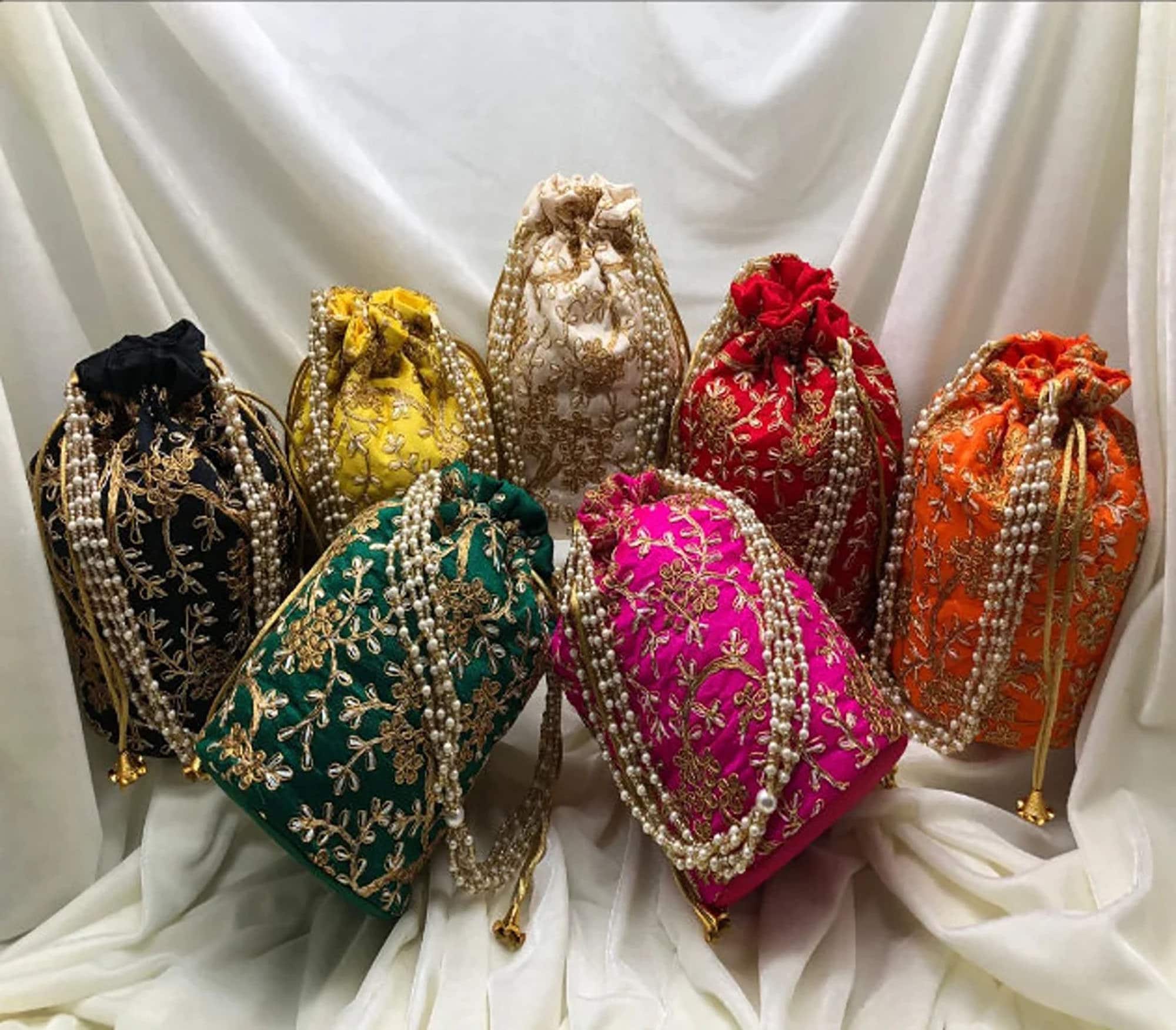 Amazon.com: Designer Women Potli Bags - Rajasthan batwa for Wedding and  Parties - Indian Ethnic Designer Embroidered Silk Pouch Bag- Handle Purse  Clutch Purse for Women - Batwa Pearls Handle Bag, Pack