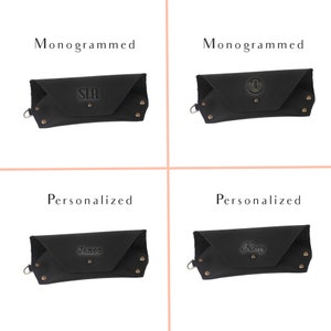 May include: Four black leather cases with different personalization options. The top left case is monogrammed with the letters "SLA". The top right case is monogrammed with the letter "T". The bottom left case is personalized with the name "James". The bottom right case is personalized with the name "Kerry".