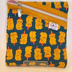 May include: A handmade wooden sign with the text "Welcome" in a whimsical font. The sign is painted white with a distressed finish, and features a decorative floral design in shades of pink and green. It measures approximately 12 inches wide.