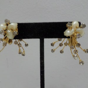 Vintage clip on earrings gold tone metal with clear rhinestones costume jewelry