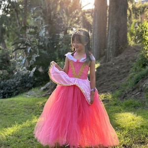aurora pink dress movie Why is Aurora's signature dress pink even though she only wore it for a few seconds? : r/disneyprincess