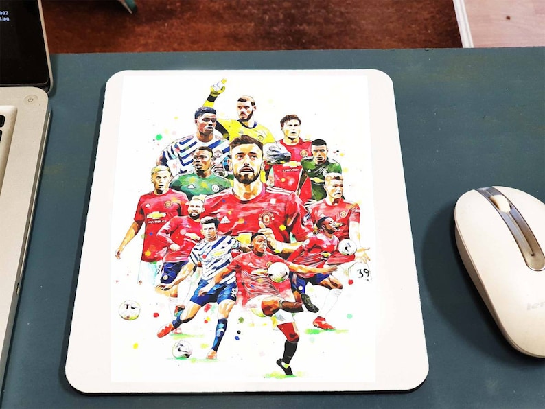 May include: A watercolour illustration of a group of football players in red and blue kits. The players are in various poses, some are kicking a ball, others are running, and some are standing. The background is a white canvas with splashes of colour.