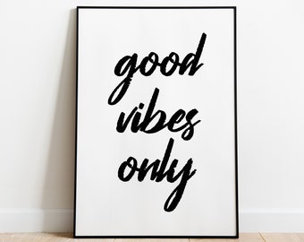 May include: Black and white typography print with the text "good vibes only" in a handwritten style.