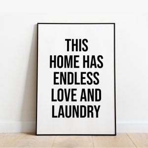 May include: Black and white print with the text "This home has endless love and laundry" on a white background.