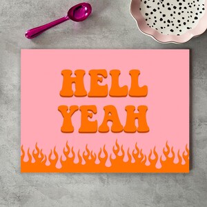 May include: Pink and orange kitchen print with the text "HELL YEAH" in a retro font. The bottom of the print features a row of orange flames.