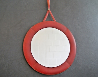 round wall mirror in red leather frame, small round mirror framed, mid century wall mirror