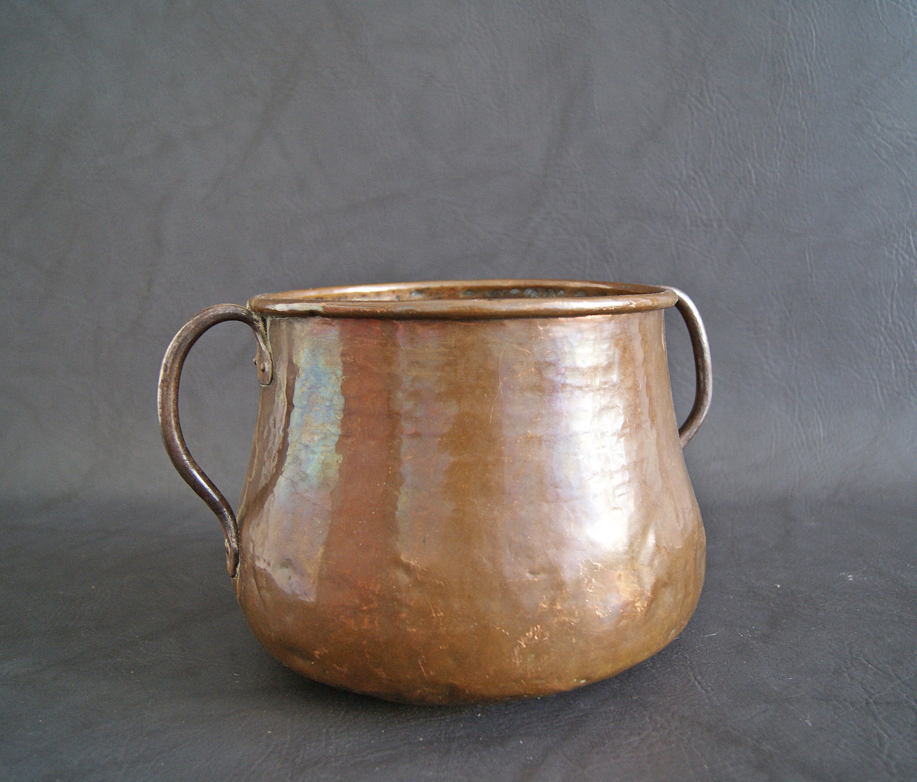 Old copper copper pot with handles, old container, plant pot