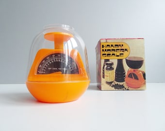 small retro kitchen scale or letter scale in orange