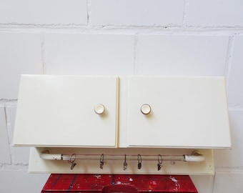 Kitchen hanging cabinet with glass hook strip 1950s