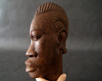 large wall mask made of palm wood, hand-carved wooden mask