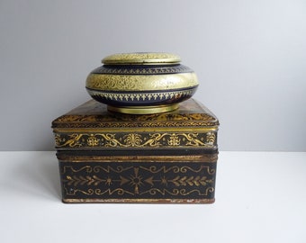 Set of three old tin cans