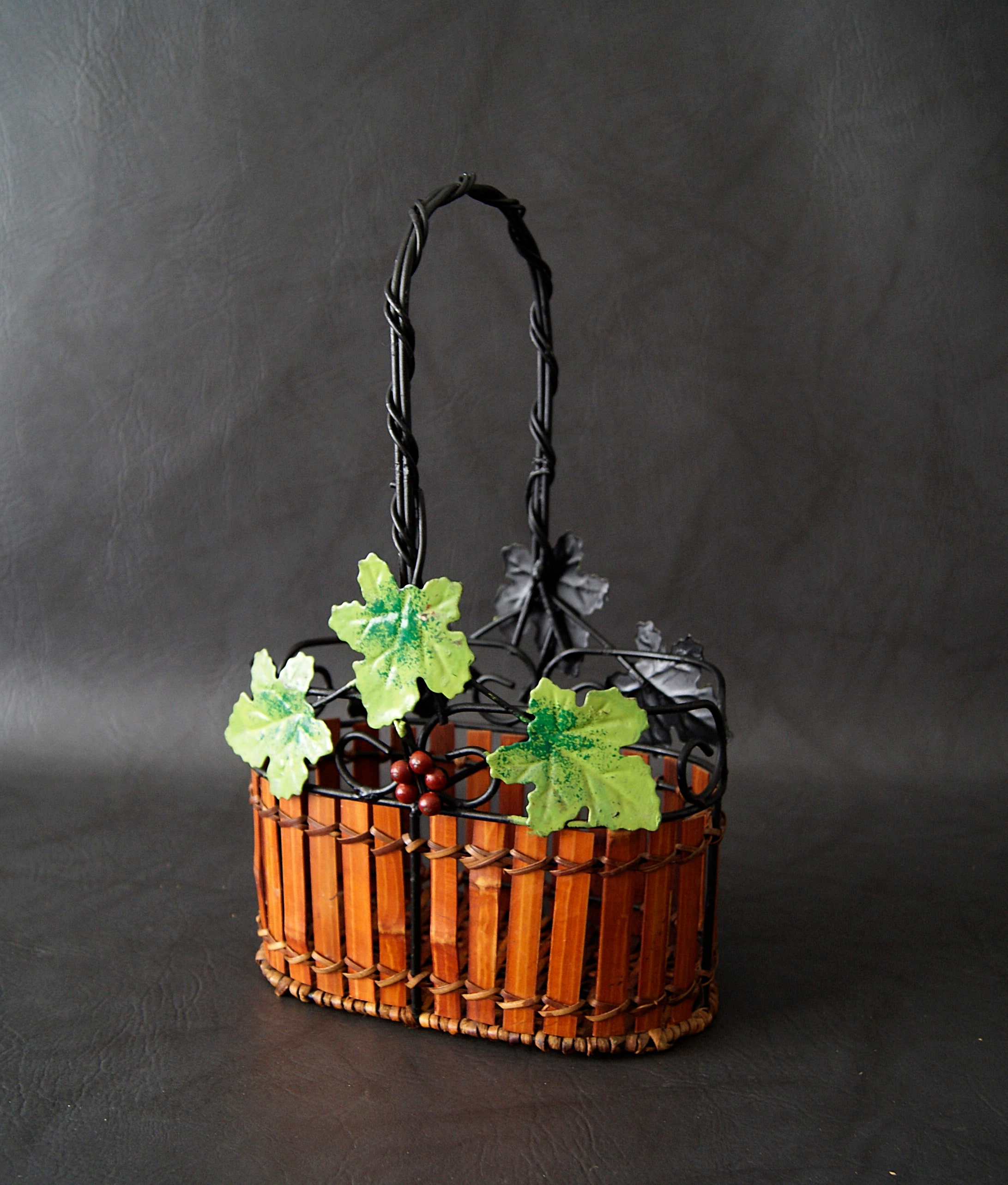 Bottle basket made of metal with vine tendrils, vintage bottle holder