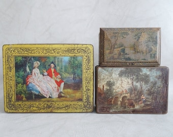 Set of three antique tin cans