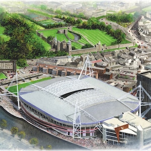 Puede incluir: Una vista aérea de un gran estadio moderno con un techo blanco y una ciudad circundante. El estadio está rodeado de un campo verde y un río. La ciudad está llena de edificios y calles.