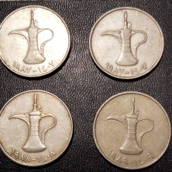 coin of the arab emirates with a lamp, arab mirnets with a lamp, coins of the arab emirates of the 1980s